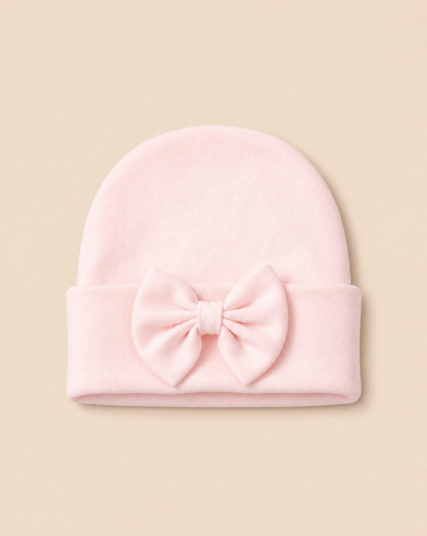 Lichtroze newborn muts met strik